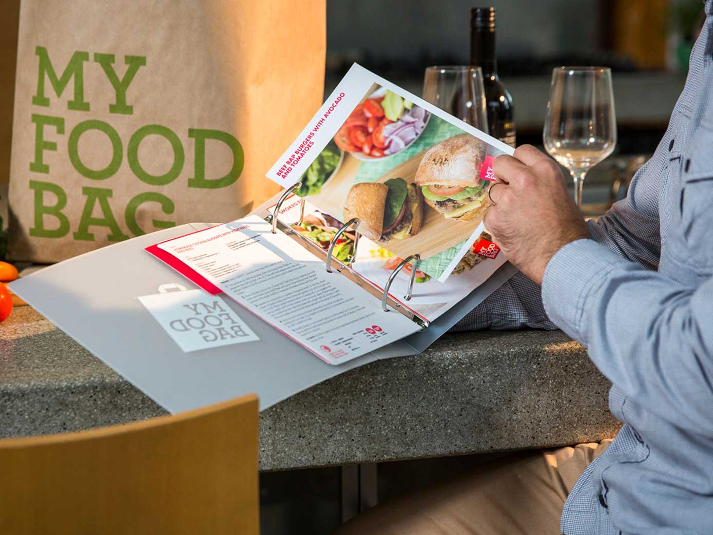 A person reading a My Food Bag booklet