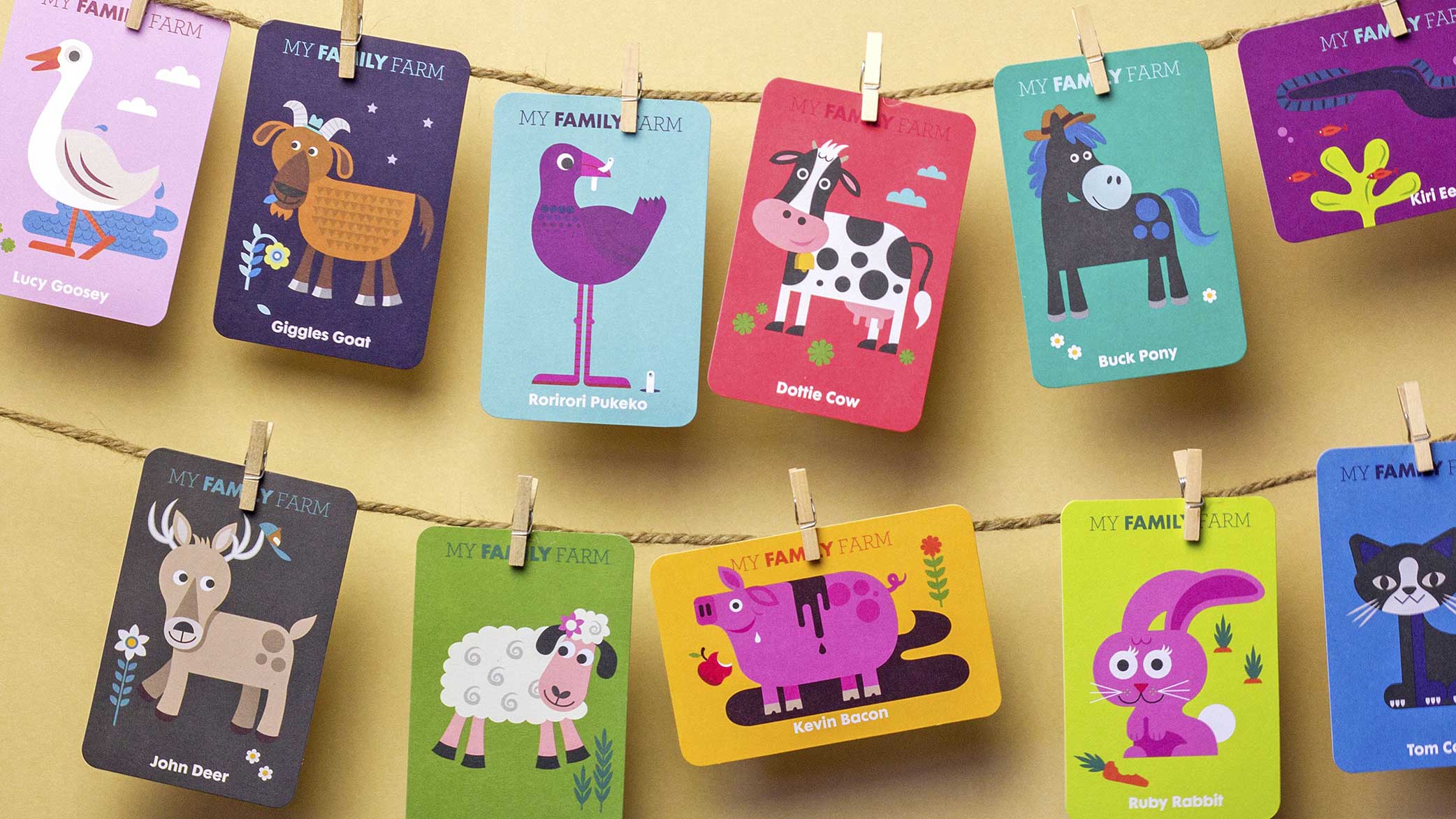 Colourful childrens' illustrations of animal cards on pegs